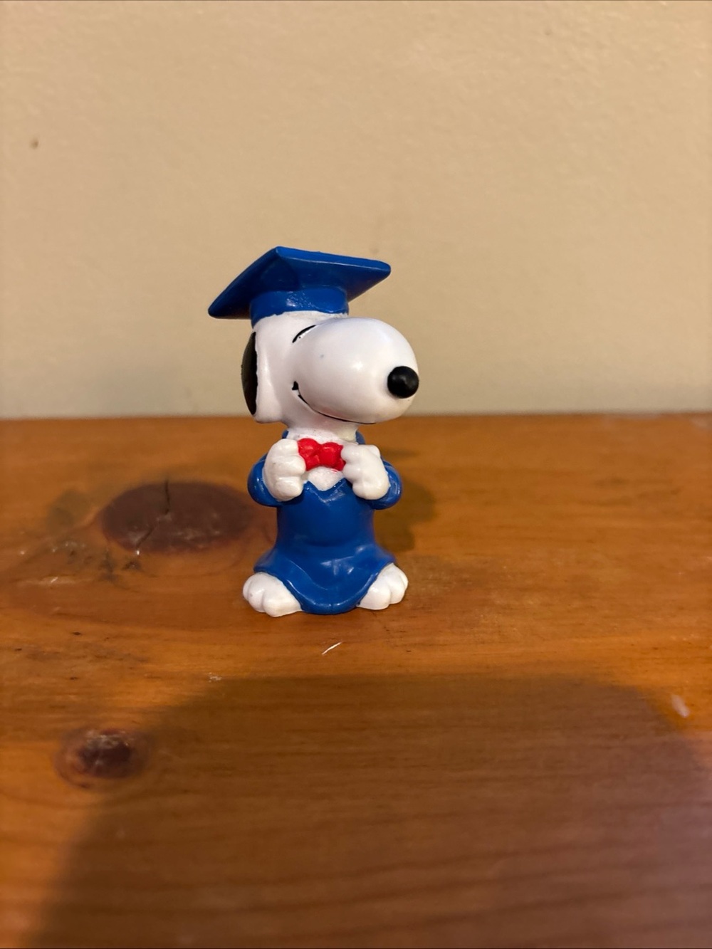 Peanuts Snoopy in Blue Graduation Cap and Gown with Red Bow